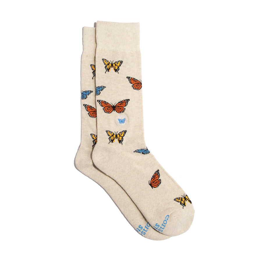 A pair of tan socks with butterflies on them